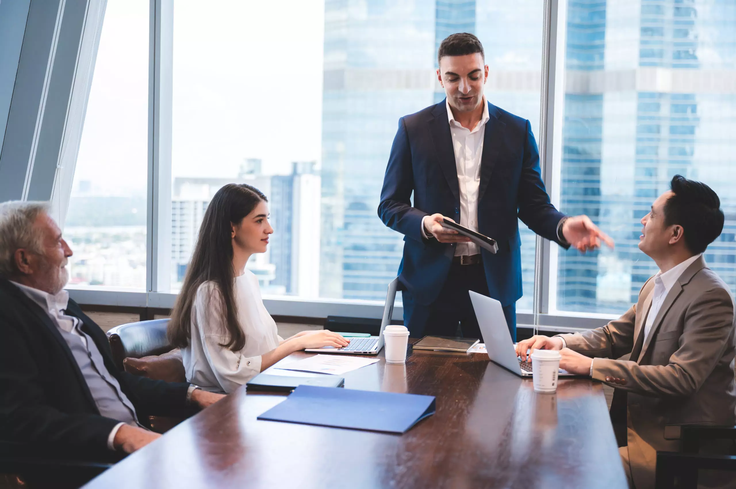 Business presentation in front of group of people.