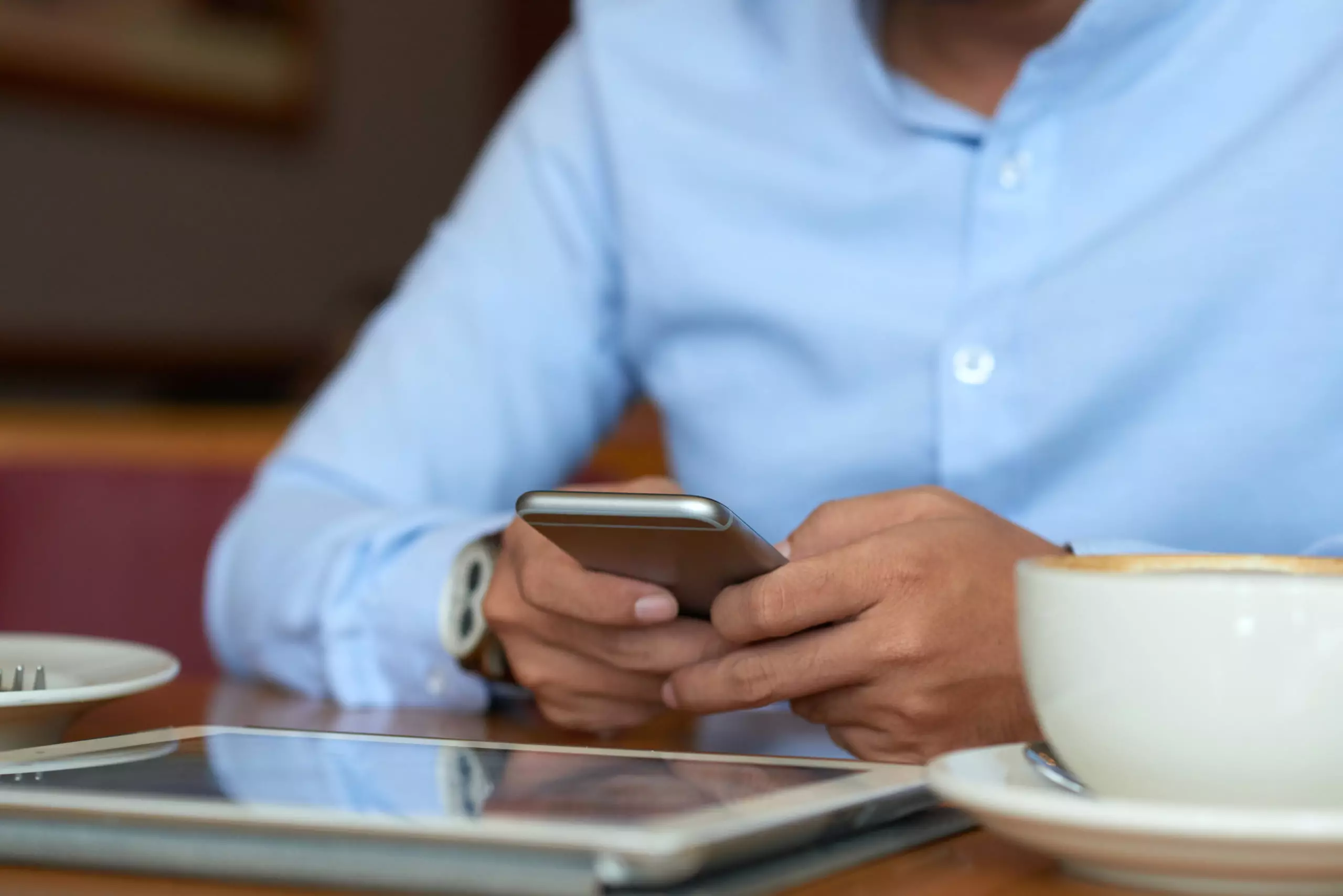 Man reading news on mobile device